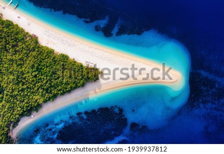 Croatia, Hvar island, Bol town. Landscape from air. Aerial view at  Zlatni Rat beach. Famous place in Croatia. Summer seascape from drone. Travel and vacation image Royalty-Free Stock Photo #1939937812
