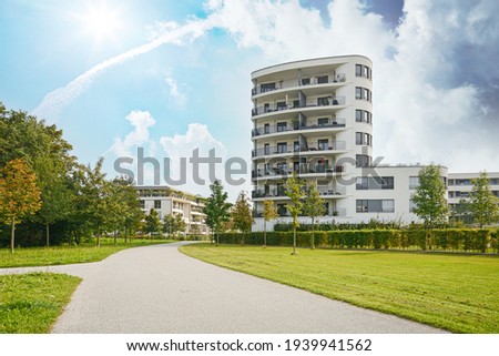 Cityscape of a residential area with modern apartment buildings, new green urban landscape in the city Royalty-Free Stock Photo #1939941562