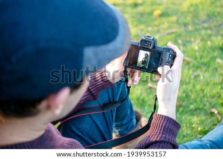 Hand of a man taking a picture