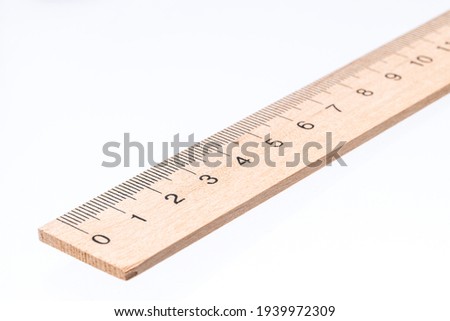 wooden ruler isolated on white background. measure school tool cut out. Royalty-Free Stock Photo #1939972309