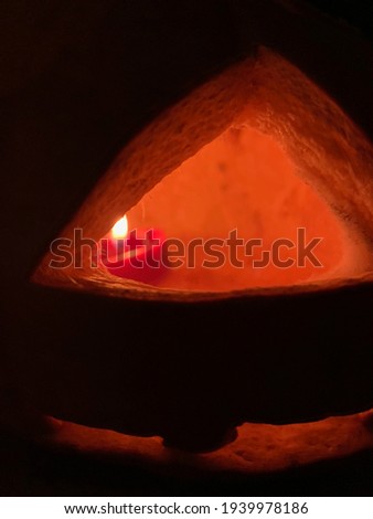 Jack o lantern with candle at night on Halloween 