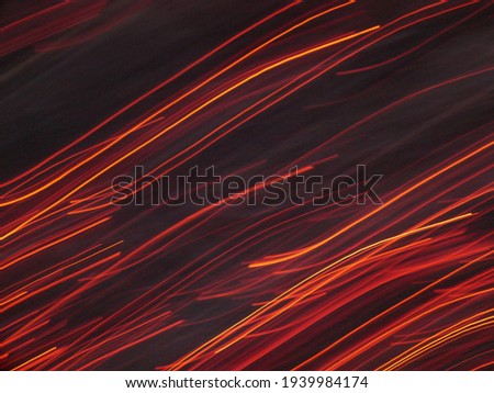 Fire flames with sparks on a black background.By shooting at high speed.