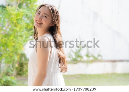 Portrait of one cute Japanese woman Royalty-Free Stock Photo #1939988209