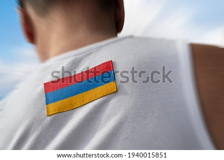 The national flag of Armenia on the athlete's back