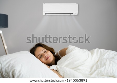 Air Conditioner Appliance Or Condition In Bedroom Royalty-Free Stock Photo #1940053891
