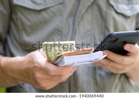 Hands holding money and concept saving money, business growth strategy of money concept, advertising banknote of finance and banking