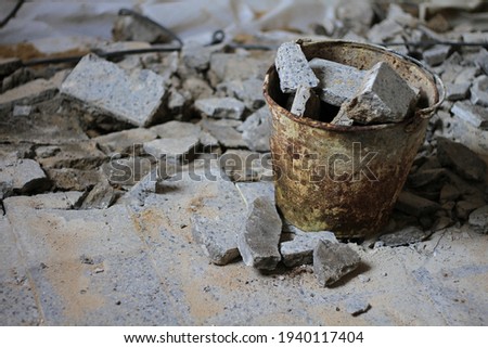 broken concrete rubble in the bucket stock photo