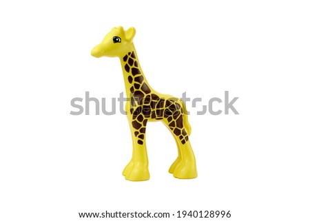 Plastic giraffe toy isolated on white background.