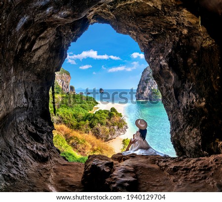 Woman sitting in the cave at Railay, Krabi, Thailand.