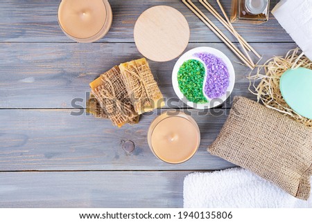 Different spa and bathroom products isolated on wooden background. Products for beauty treatments and body care
