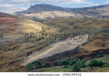 Remains of Noah's Ark with boat shaped rock formation at the spot near Mt Ararat where it is believed that the ark was rested in Dogubeyazit, Turkey Royalty-Free Stock Photo #1940149942