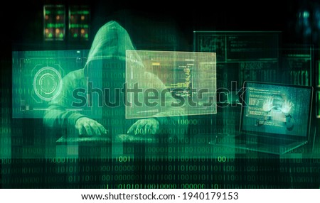 cyber security concept  hooded hacker  Royalty-Free Stock Photo #1940179153