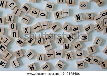Wooden letters on a white back ground.  Concept education, business, and reading.