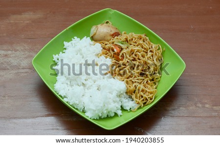 chicken noodle with rice on a plate