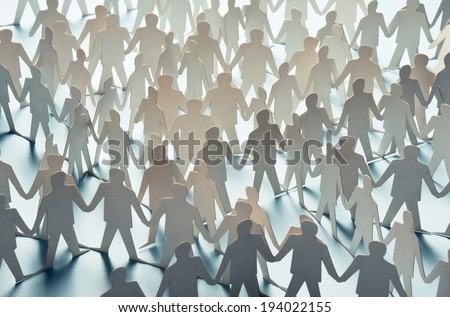 Paper cut figures connected to one another Royalty-Free Stock Photo #194022155