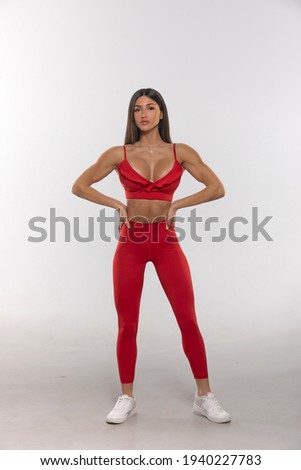 girl in red leggings and a top on a white background
