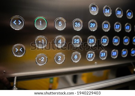 Car cabin operating panel (COP) of elevator. Elevator call buttons.