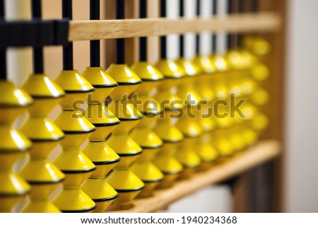 Big japanese abacus. Mental arithmetic school. Back to school concept. Abacus for calculation, background. Education, school arithmetic, calculating thinking and early development. Royalty-Free Stock Photo #1940234368