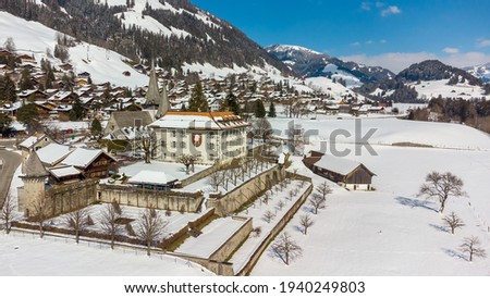 Drone picture of the snow-capped village of Rougemont, Switzerland. 