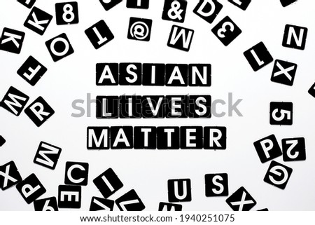 Anti-racist concept-cards with letters laid out on paper. Banner poster background for protester. Asian lives metter. Support for Asian-American communities.Equality
