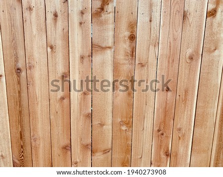 Warm golden red fence boards as a background