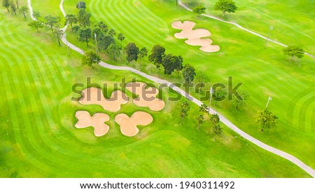 Aerial view of Golf Course with putting green grass and trees on a golf field, fairway and putting green top view. bird view over Golf coursesport, Golfing on Holidays