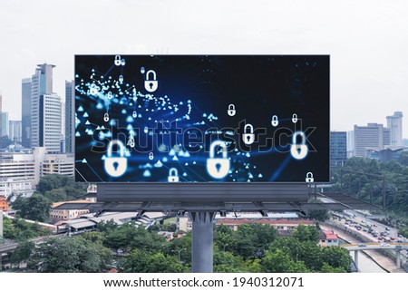 Padlock icon hologram on road billboard over panorama city view of Kuala Lumpur at day time to protect business, Malaysia, Asia. The concept of information security shields.