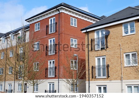 Modern two and three storey apartment blocks in the Leggatts Green area of Watford, Hertfordshire, UK Royalty-Free Stock Photo #1940357152