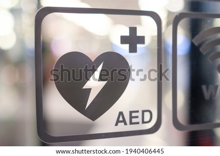An automated external defibrillator AED sign in public place. Emergency defibrillator. 