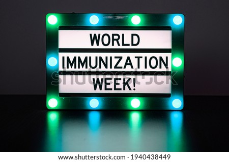 Lightbox with green lights with words - World immunization week!