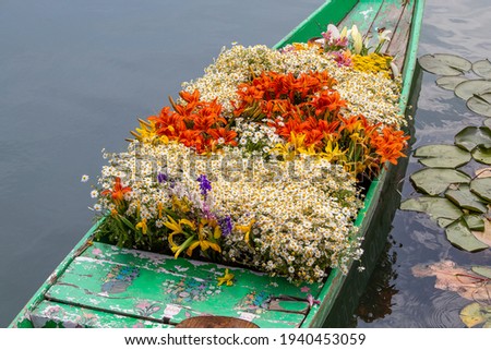 Flowers on boat at floating market in morning. Srinagar, India