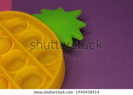 Antistress silicone toy trend of 2021 in the form of pineapple