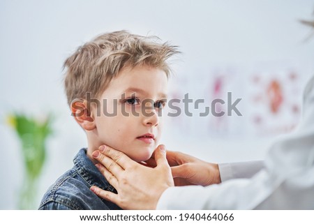 Little boy having medical examination by pediatrician Royalty-Free Stock Photo #1940464066