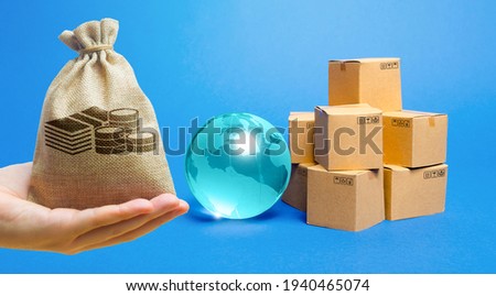 Money bag, blue glass globe and cardboard boxes. International world trade distribution. Delivery of goods, shipping. Global economy, import export freight traffic. Globalization markets.