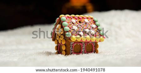 Neatly decorated ginger bread house.