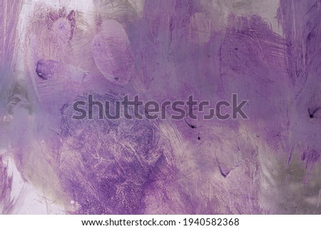 purple spots and streaks on the glass. dried old paint.