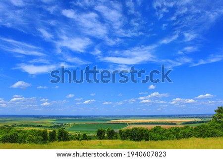 Rural landscape with beautiful clouds, fine sunny weather in summertime Royalty-Free Stock Photo #1940607823
