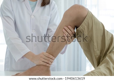 Male patients consulted physiotherapists with knee pain problems for examination and treatment in rehabilitation centers. Rehabilitation physiotherapy concept.