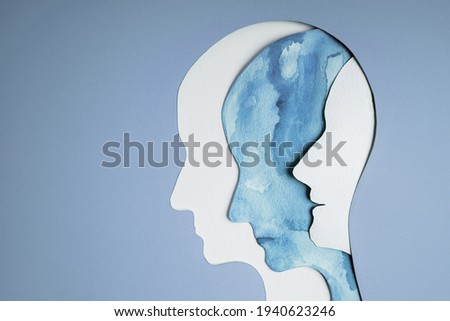 Mental Health Disorder Concept. Bipolar Disorder Person. Unstable Psycho. Layers of Paper Cut as Human Head presenting Different of Emotions. Happiness and Depression Emotion inside Royalty-Free Stock Photo #1940623246
