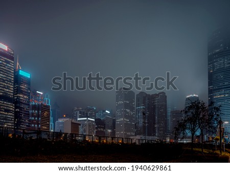 Modern office buildings in Hong Kong at foggy night 