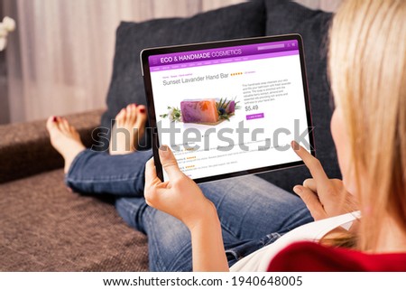 Woman shopping online for natural and hand made cosmetics