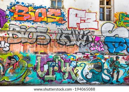 Beautiful street art graffiti. Abstract creative drawing fashion colors on the walls of the city. Urban Contemporary Culture
