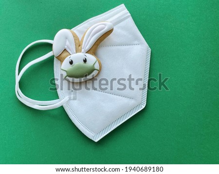 Easter bunny in a face protective mask. Easter pandemic celebration 2021