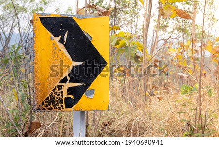 The traffic signs were burned by a wildfire. Environmental forest fire concept.