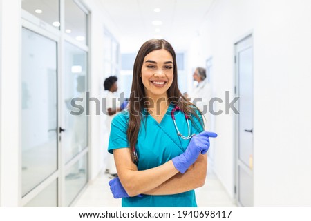 Doctor or nurse woman wearing scrubs and stethoscope on shoulders looking at camera, doctor make video call interact through internet talk with patient provide help counseling and therapy concept