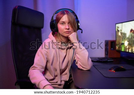 Portrait of streamer gamer girl in neon lights