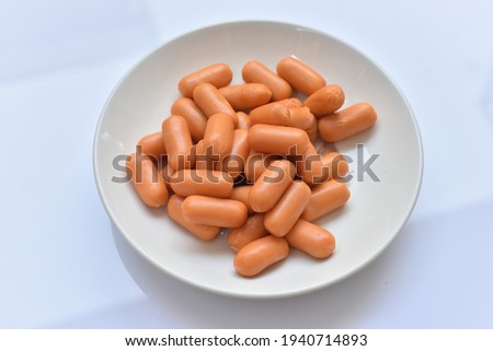 Sausage In a white plate on a white background