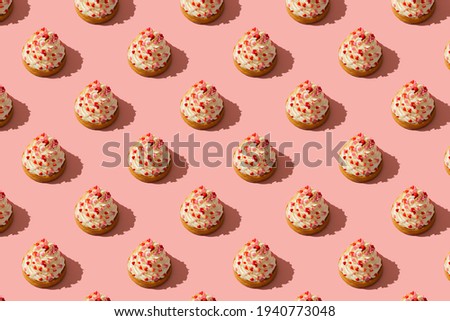 Cupcake with cream on mothers day or valentines on pink background, copy space, minimalism, creative, seamless pattern
