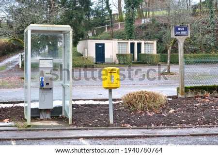 Deserted Public Car Park with Telephone Kiosk  Toilets and Yellow Mail Box 