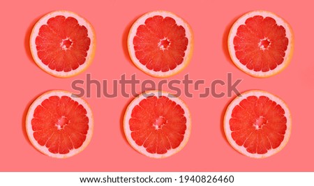Slices of delicious grapefruit on a bright background,lying flat. fruit slices on a light background, contrasting background that attracts attention.advertising for a cooking blog. bright juicy colors